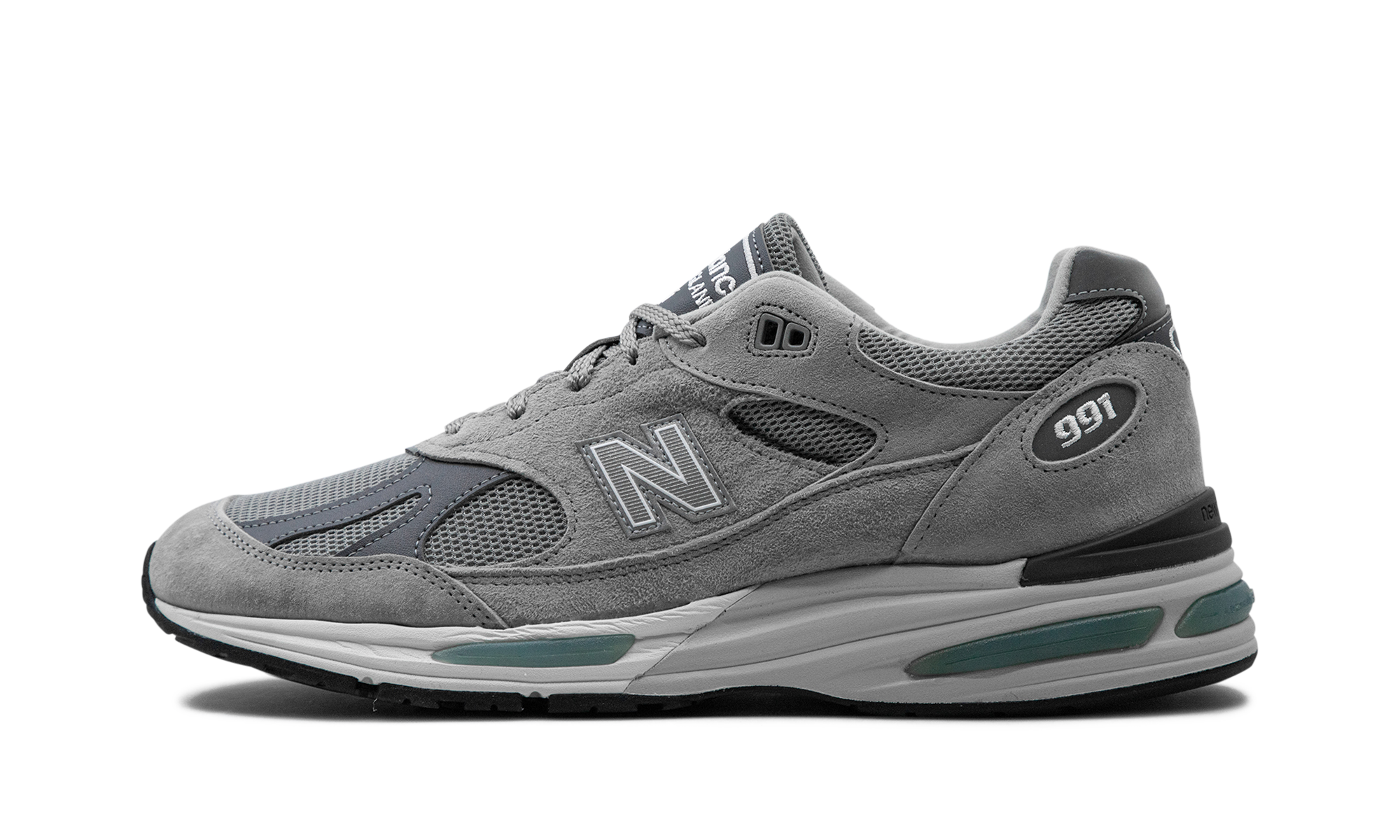 New Balance 991 in Grau mit grünen Akzenten in der Sohle